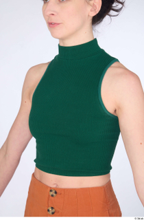 Zolzaya casual dressed green turtleneck sleeveless crop top upper body…